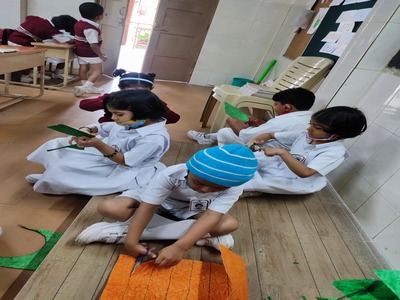 Children doing activity using scissors