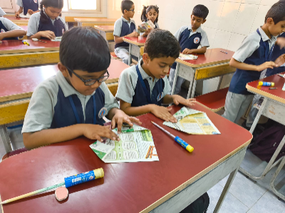 Primary students engaged in a reading and writing activity